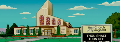 A picture of Springfield church from the Simpsons cartoon with a wayside pulpit stating 'Thou Shalt Turn Off Thy Cell Phone'